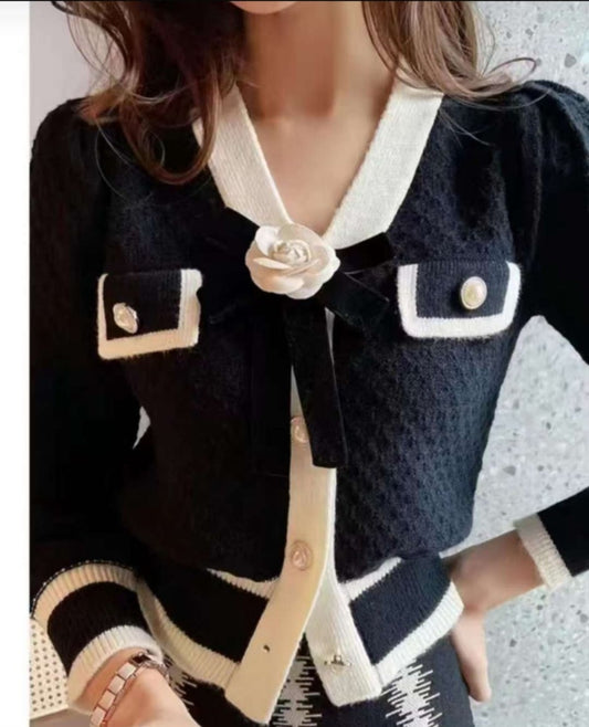 Divamo - Chic Black & White Contrast Blouson with Rose Detail